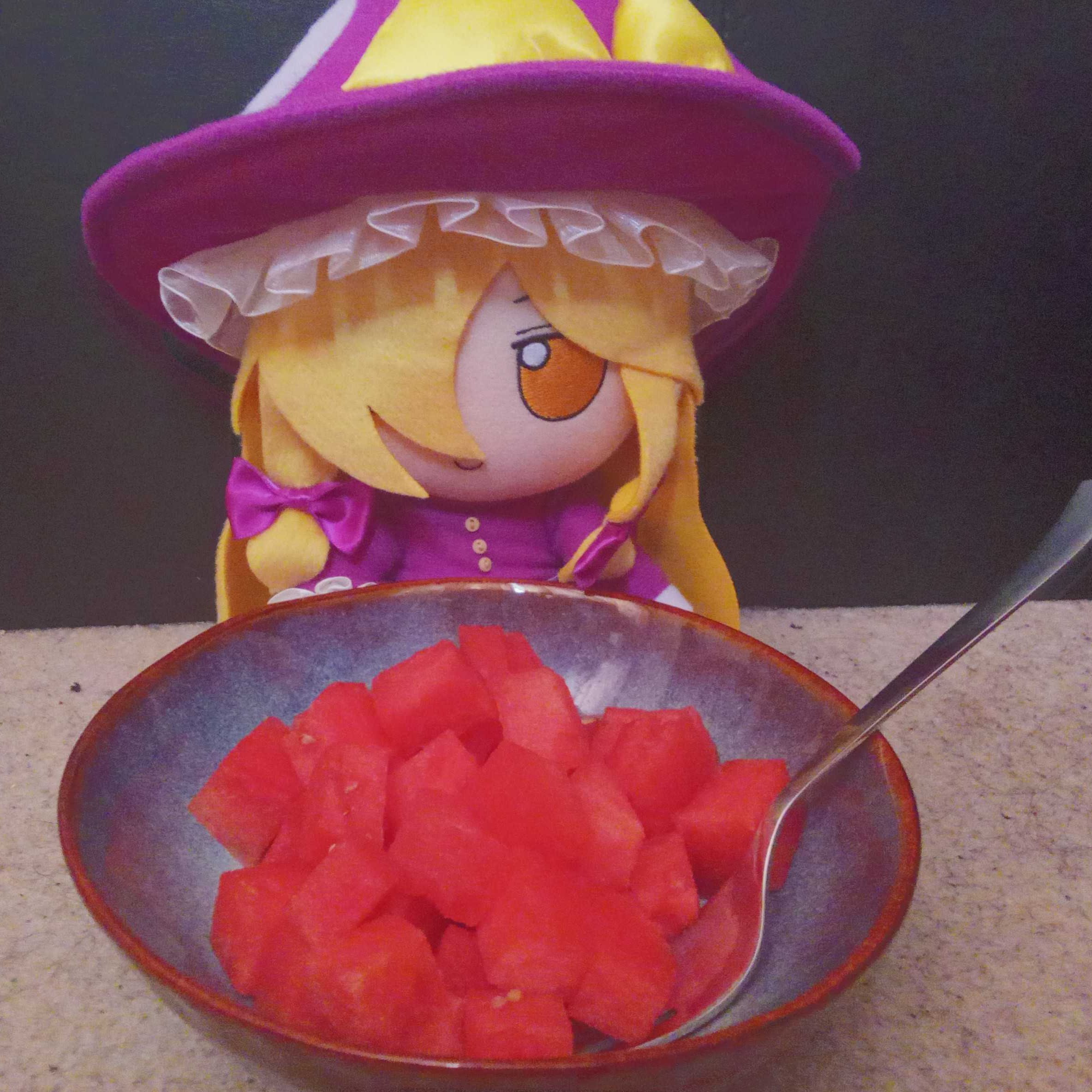 ...what more do you want me to say? she's eating a watermelon.